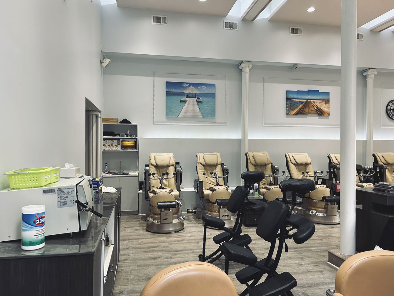 The interior of the nail salon has several luxury reclining chairs for pedicures.