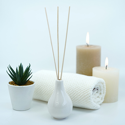 Aromatherapy, candles, white towels and plants